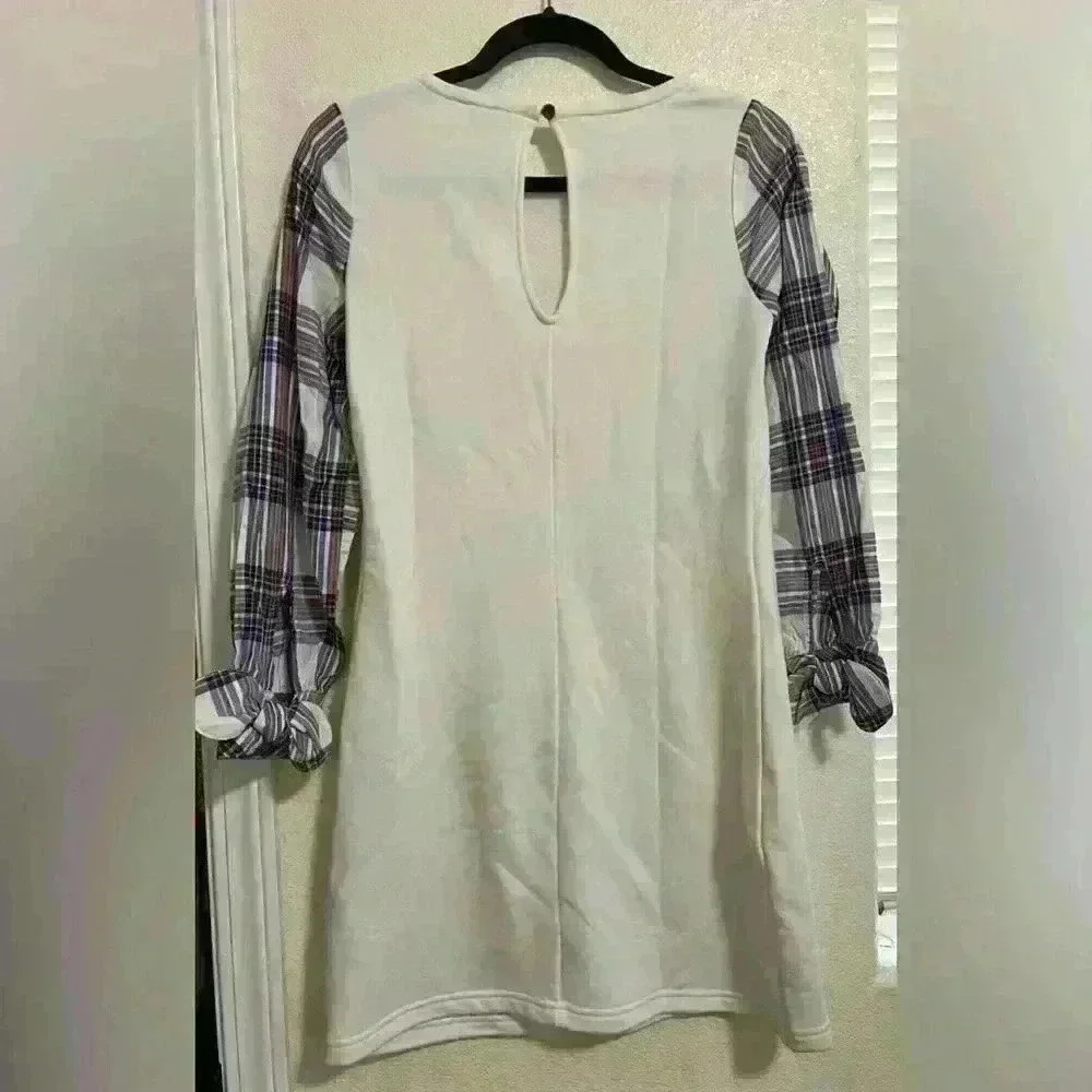 White dress with plaid sleeves